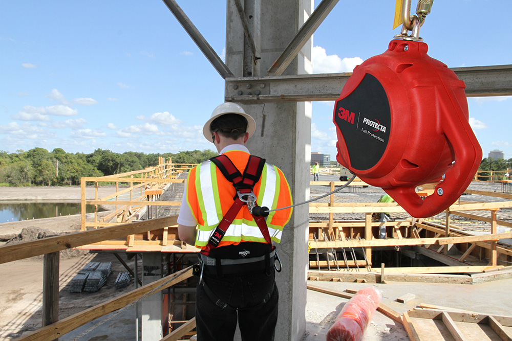 Image of a person on a rooftop with guardrails